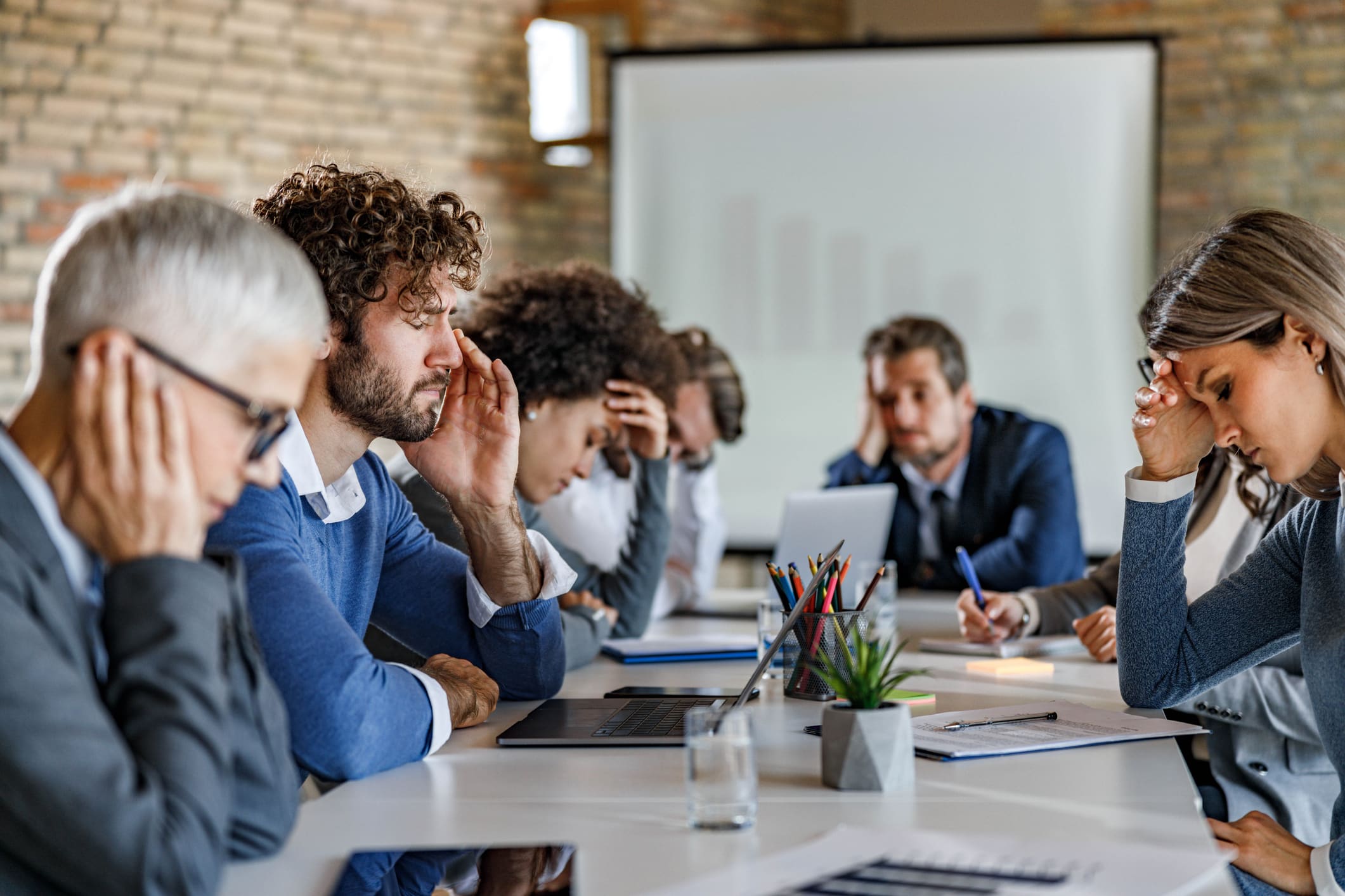 Photo of business people feeling displeased in a meeting in the office.