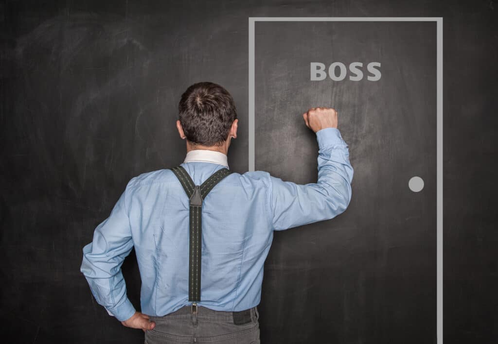 Image of employee knocking on the boss's door.
